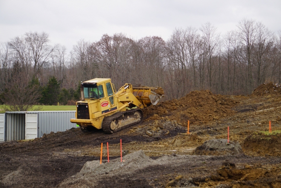 bulldozer on a mound of dirt